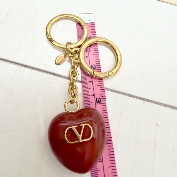 JULIETTA Gold-tone resin bag charm | NET-A-PORTER Valentino Garavani Puffy Heart Keychain Bag Charm